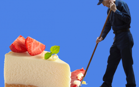 Janitor mops up a slice of cheesecake.
