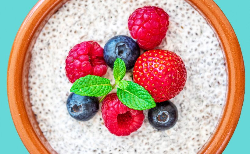 Chia seed pudding in a bowl topped with berries.