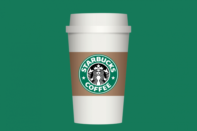 Starbucks cup on green background.