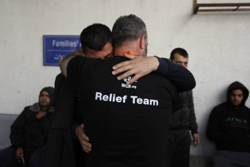 Two men become emotional and comfort each other as they receive the bodies of World Central Kitchen workers who were killed by Israeli air strikes on April 02, 2024 in Rafah, Gaza. 