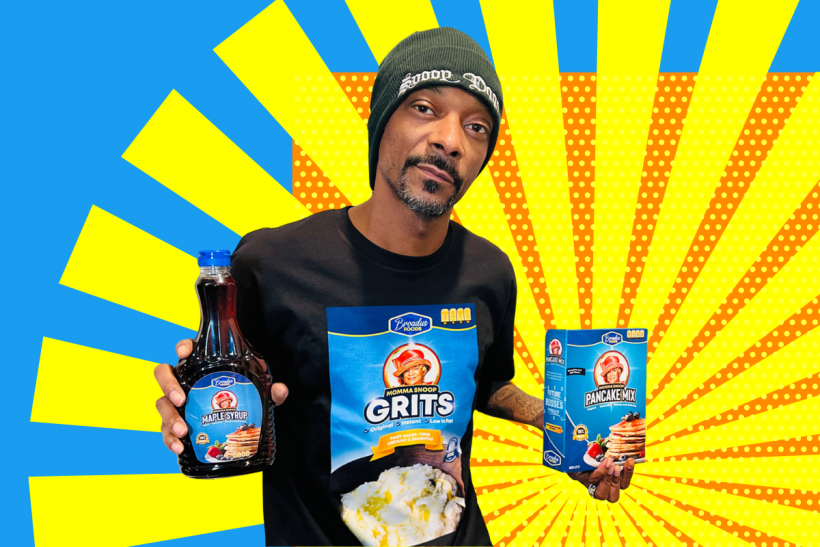 Snoop Dogg poses with items from his Mama Snoop line of breakfast items from Broadus Foods.