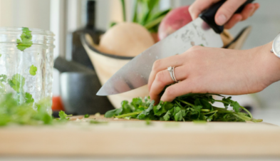 Woman chopping cilantro