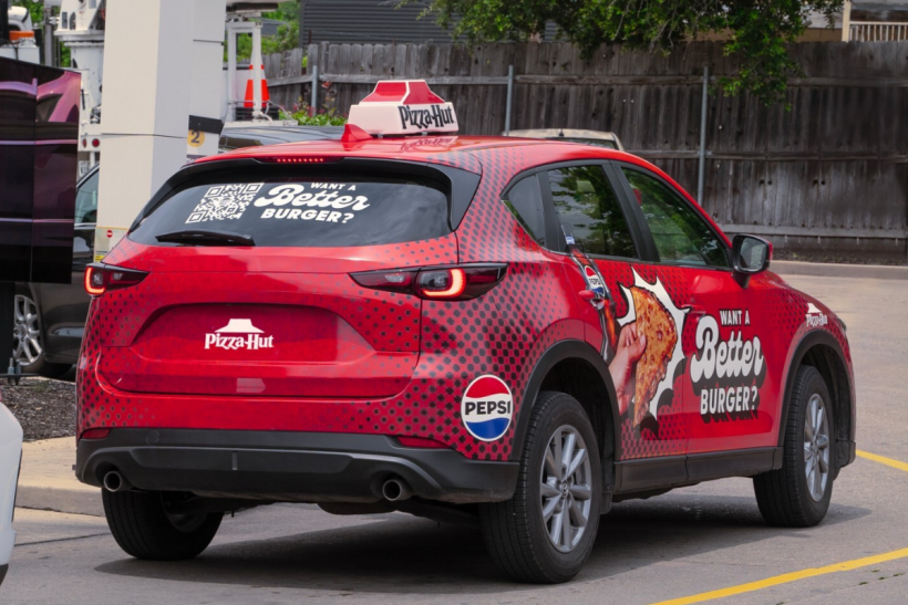 Score a free Pizza Hut burger by scanning QR codes on delivery vehicles in select markets.