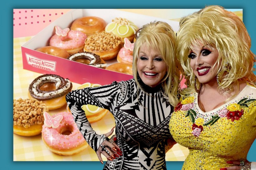 Dolly Parton and a Dolly Impersonator stand in front of a picture of her new Krispy Kreme doughnut line.