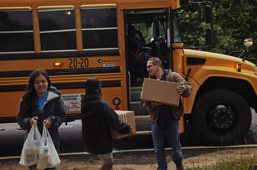 A family receives a box of food in Burke County, Georgia.