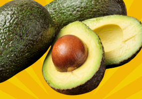 Avocados against a bright yellow background