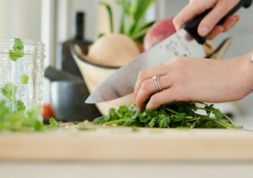 Woman chopping cilantro