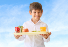 Young boy with school lunch tray